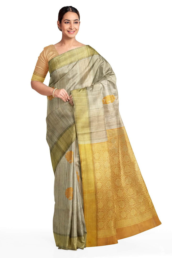 Desi tussar pure silk saree in orange  colour floral motifs on the body and a zari pallu in floral pattern