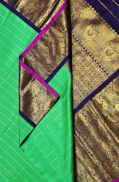 Kanchi pure silk pure zari saree in green with zari stripes