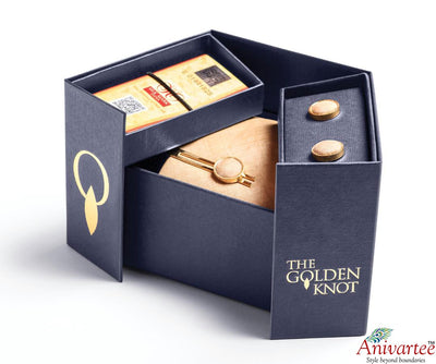 The Golden Knot - A tie with a pair of cuff links and a tie pin.