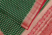 Banarasi georgette saree in bottle green with small  motifs