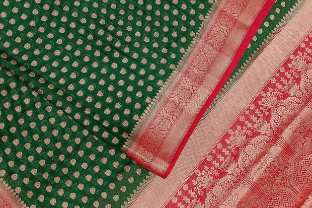 Banarasi georgette saree in bottle green with small  motifs