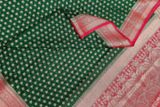 Banarasi georgette saree in bottle green with small  motifs