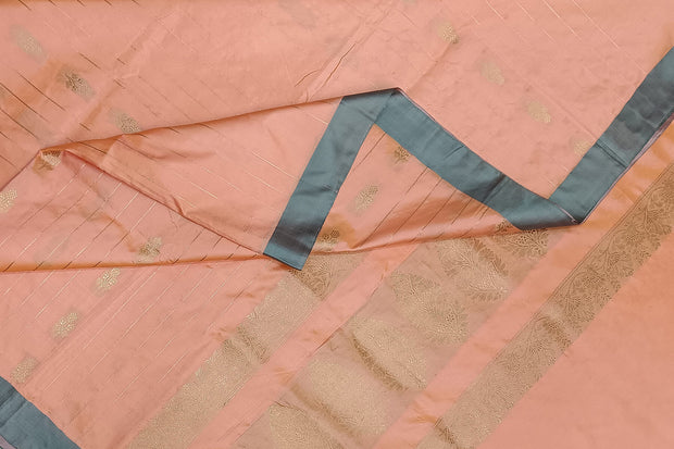 Banarasi katan pure silk saree in peach with stripes & floral motifs in gold.