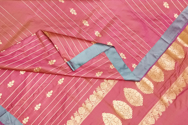 Banarasi katan pure silk saree in onion pink with stripes & floral motifs in gold.