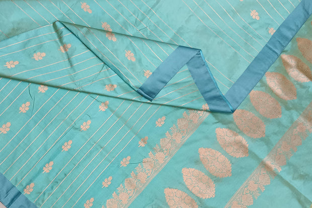 Banarasi katan pure silk saree in teal blue  with stripes & floral motifs in gold.