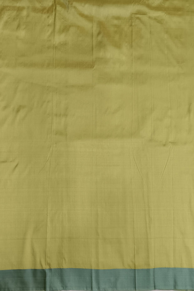 Banarasi katan pure silk saree in mehndi green  with stripes & floral motifs in gold.