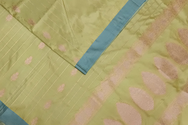 Banarasi katan pure silk saree in mehndi green  with stripes & floral motifs in gold.