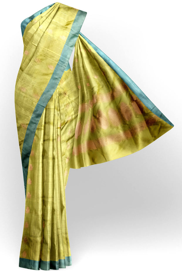 Banarasi katan pure silk saree in mehndi green  with stripes & floral motifs in gold.