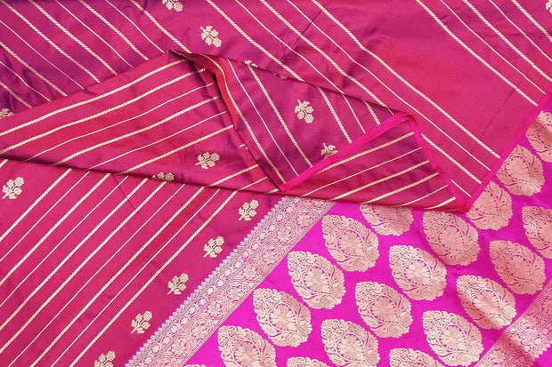 Banarasi katan pure silk saree in double shaded purple with stripes & floral motifs in gold.