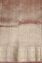 Snuff silk tissue handloom Banarasi saree with floral motifs in gold.