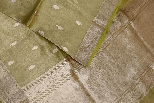Green silk tissue handloom Banarasi saree with floral motifs in gold.