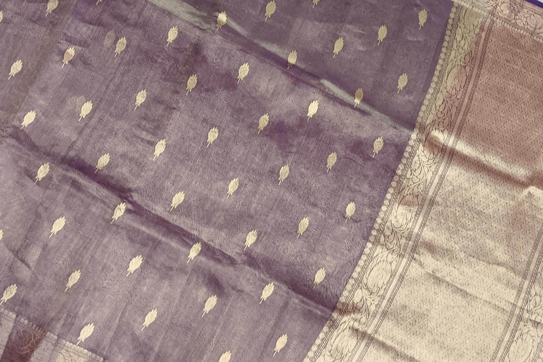 Violet silk tissue handloom Banarasi saree with floral motifs in gold.