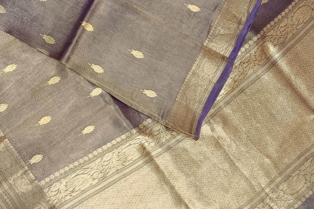 Violet silk tissue handloom Banarasi saree with floral motifs in gold.
