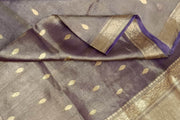 Violet silk tissue handloom Banarasi saree with floral motifs in gold.