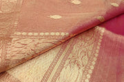 Onion pink silk tissue handloom Banarasi saree with floral motifs in gold.