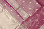 Pink silk tissue handloom Banarasi saree with floral motifs in gold.
