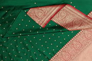 Handloom Banarasi katan pure silk saree in  bottle green with small motifs