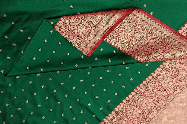 Handloom Banarasi katan pure silk saree in  bottle green with small motifs