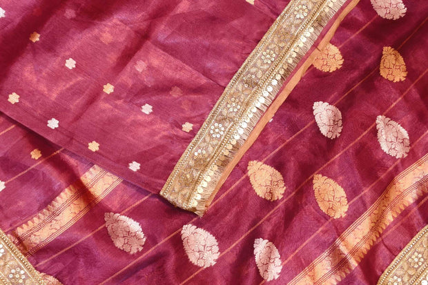 Handloom Banarasi silk tissue saree in wine with floral motifs