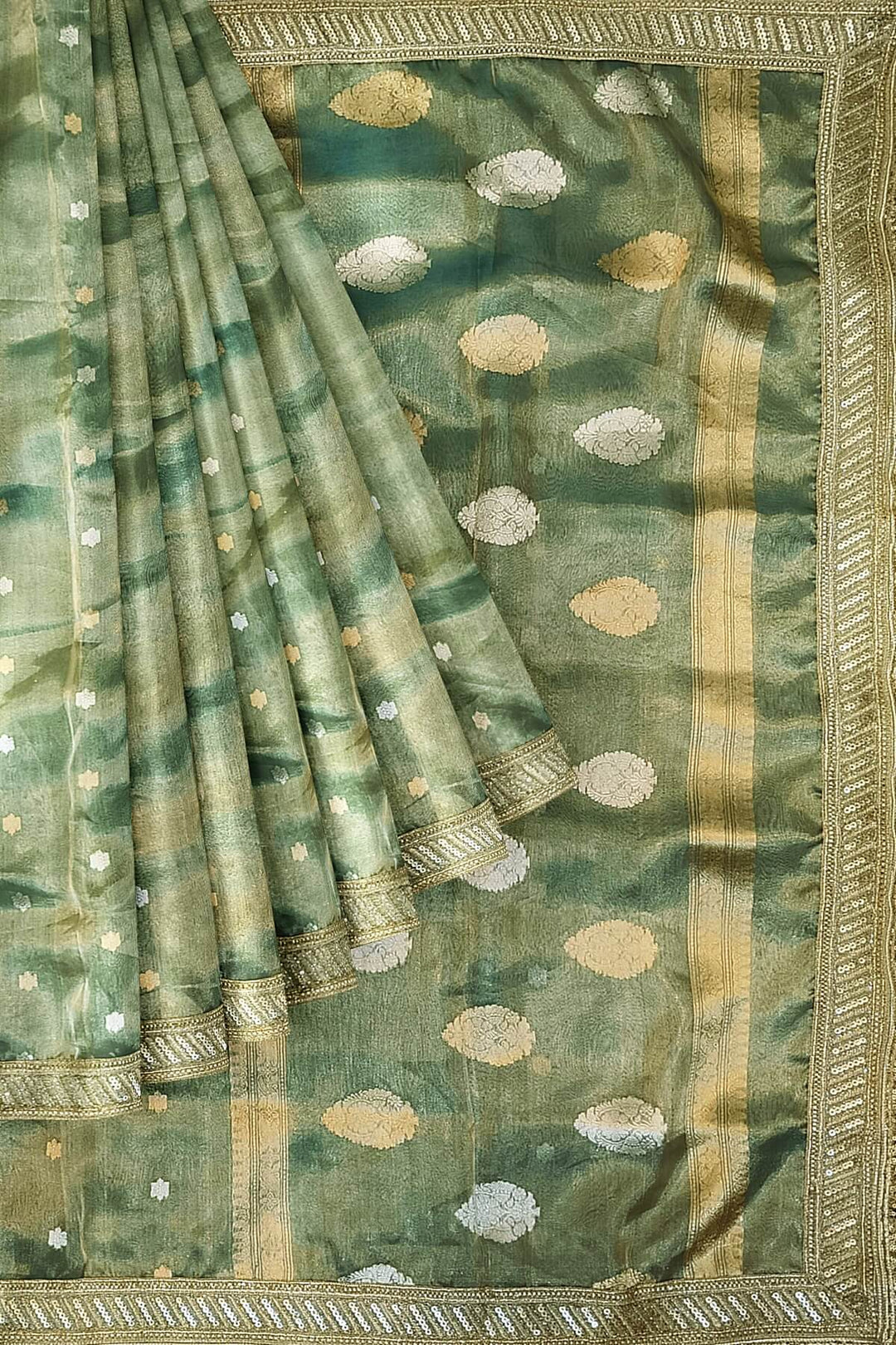 Handloom Banarasi silk tissue saree in sage green with floral motifs
