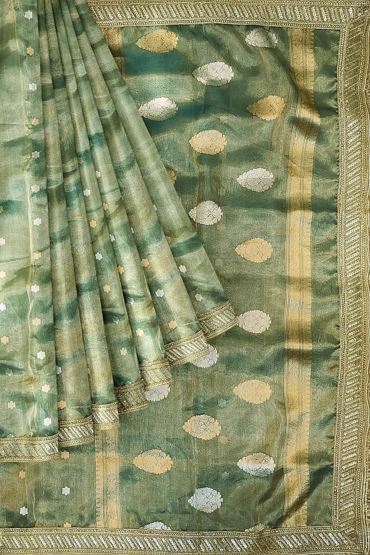 Handloom Banarasi silk tissue saree in sage green with floral motifs