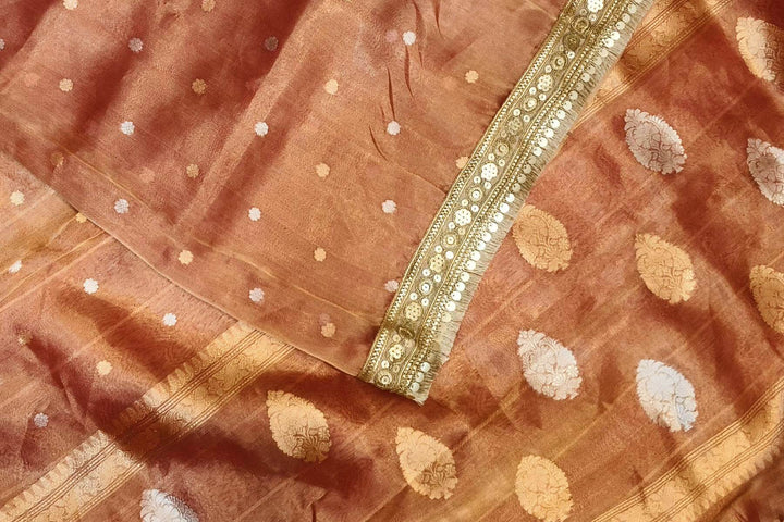 Handloom Banarasi silk tissue saree in rust with floral motifs