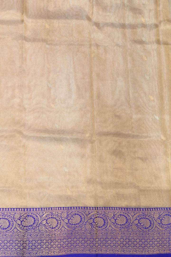 Banarasi silk tissue saree in  gold with small motifs
