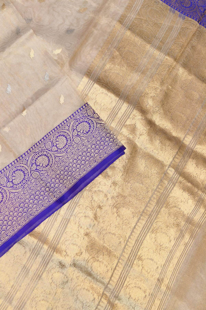 Banarasi silk tissue saree in  gold with small motifs