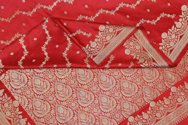 Banarasi mashru silk saree in  magenta in leheriya pattern with motifs .