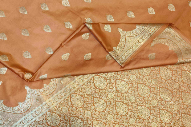 Banarasi mashru silk saree in  peach  with floral motifs