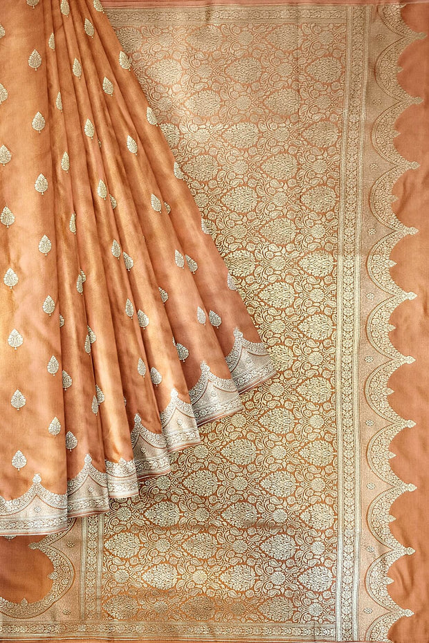 Banarasi mashru silk saree in  peach  with floral motifs