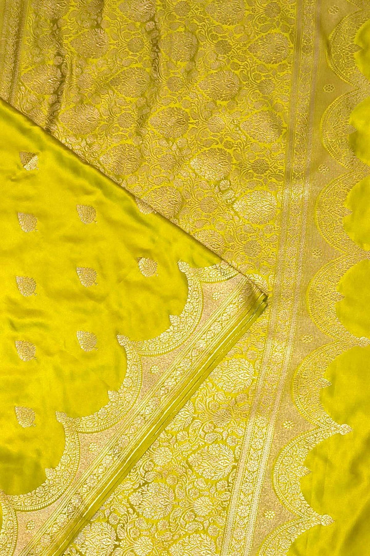 Banarasi mashru silk saree in  radium green  with floral motifs