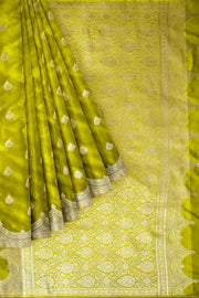 Banarasi mashru silk saree in  radium green  with floral motifs
