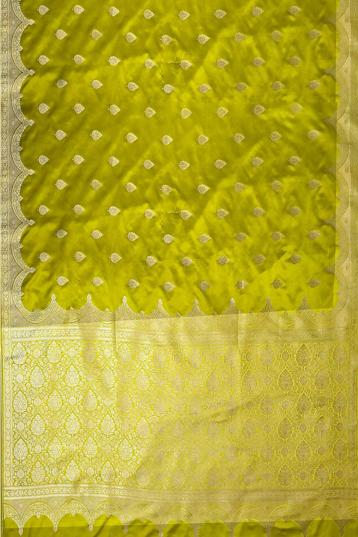 Banarasi mashru silk saree in  radium green  with floral motifs