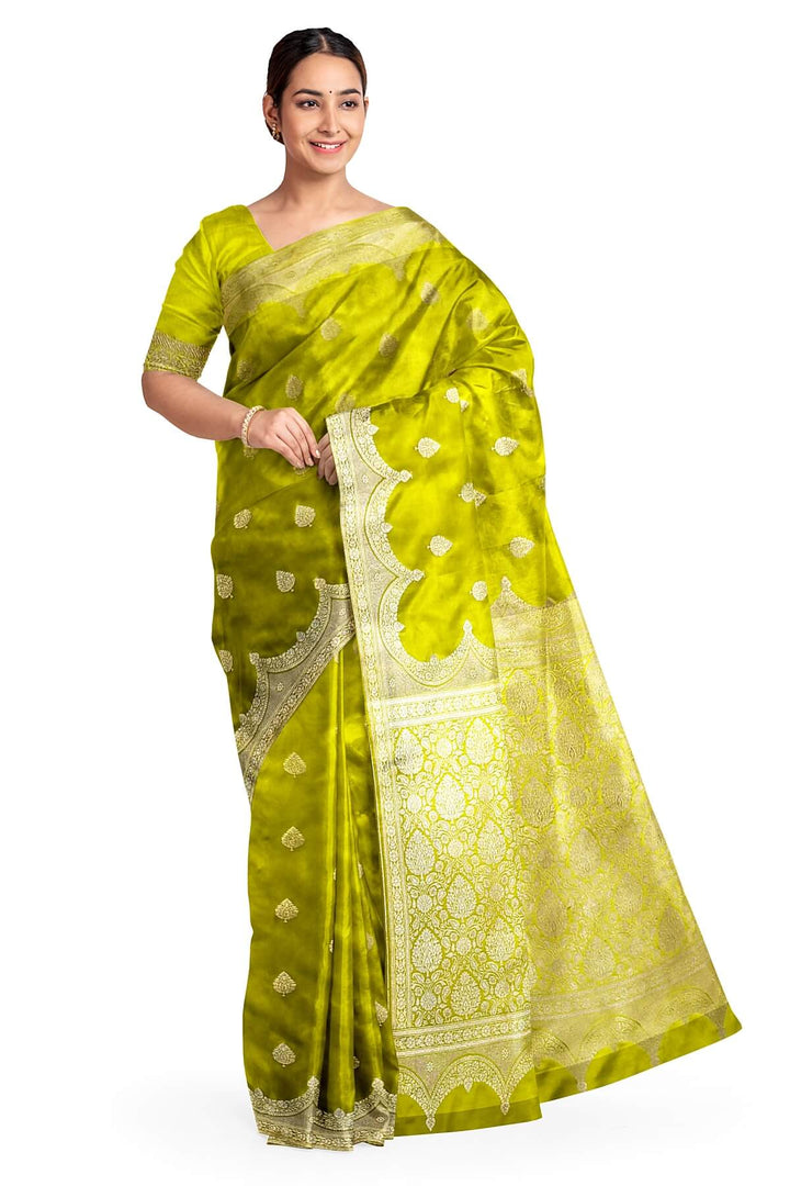 Banarasi mashru silk saree in  radium green  with floral motifs