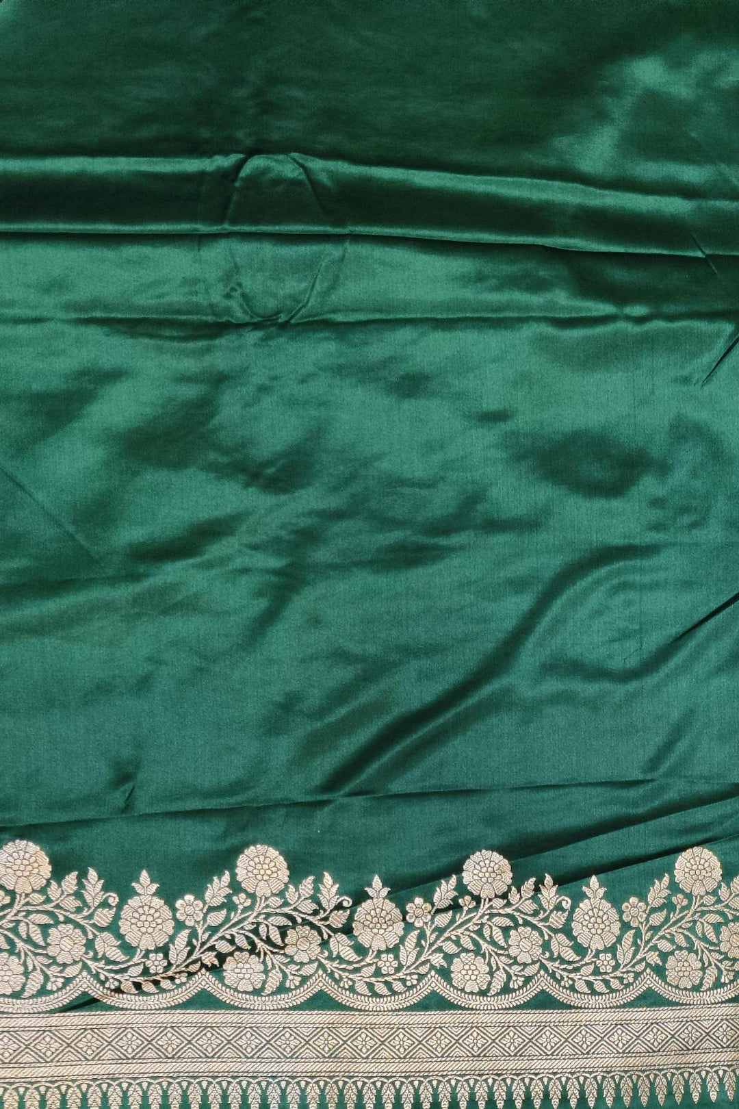 Banarasi mashru silk saree in  bottle  green  with floral motifs