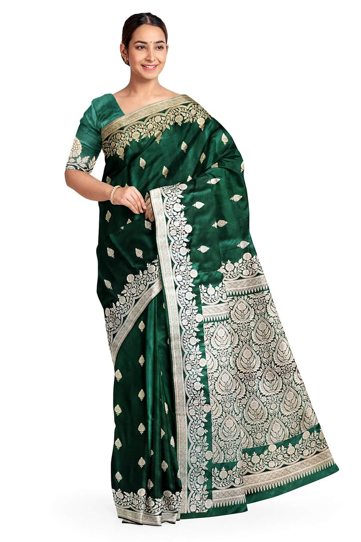 Banarasi mashru silk saree in  bottle  green  with floral motifs