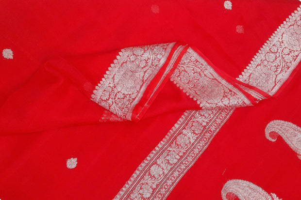 Banarasi silk chiffon  saree in red with silver  buttis &  border