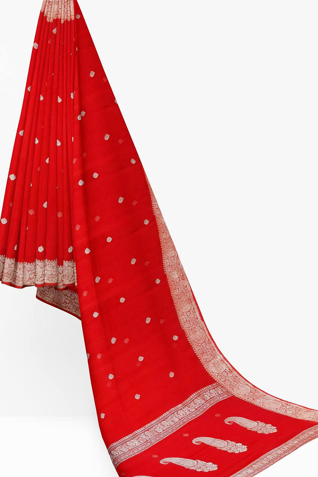 Banarasi silk chiffon  saree in red with silver  buttis &  border