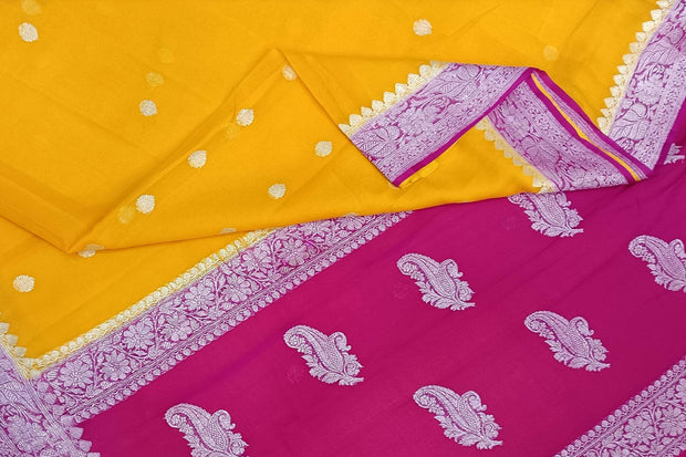 Banarasi silk chiffon  saree in mustard  with silver  buttis &  border