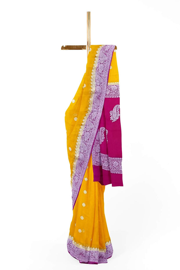 Banarasi silk chiffon  saree in mustard  with silver  buttis &  border