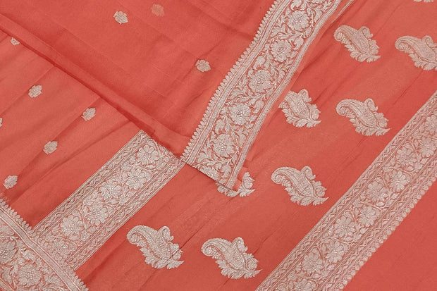 Banarasi silk chiffon  saree in peach  with silver  buttis &  border