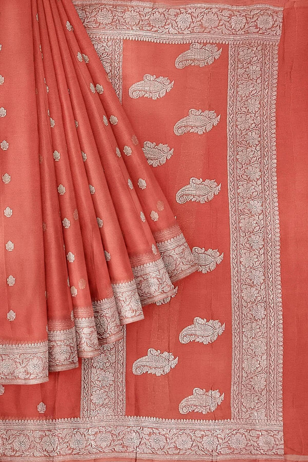 Banarasi silk chiffon  saree in peach  with silver  buttis &  border