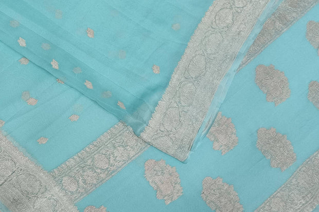 Banarasi silk chiffon  saree in sea blue  with silver  buttis &  border