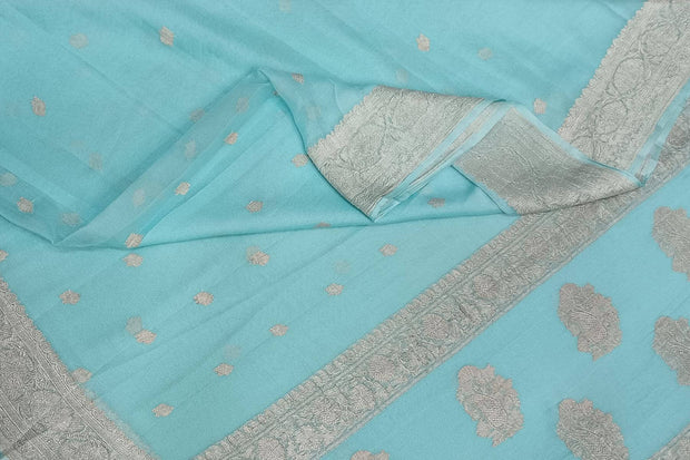 Banarasi silk chiffon  saree in sea blue  with silver  buttis &  border