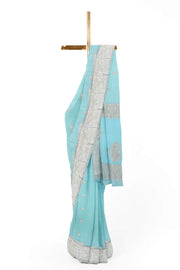 Banarasi silk chiffon  saree in sea blue  with silver  buttis &  border