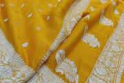 Banarasi silk chiffon  saree in yellow  with silver  buttis &  border