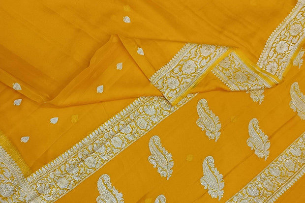Banarasi silk chiffon  saree in yellow  with silver  buttis &  border