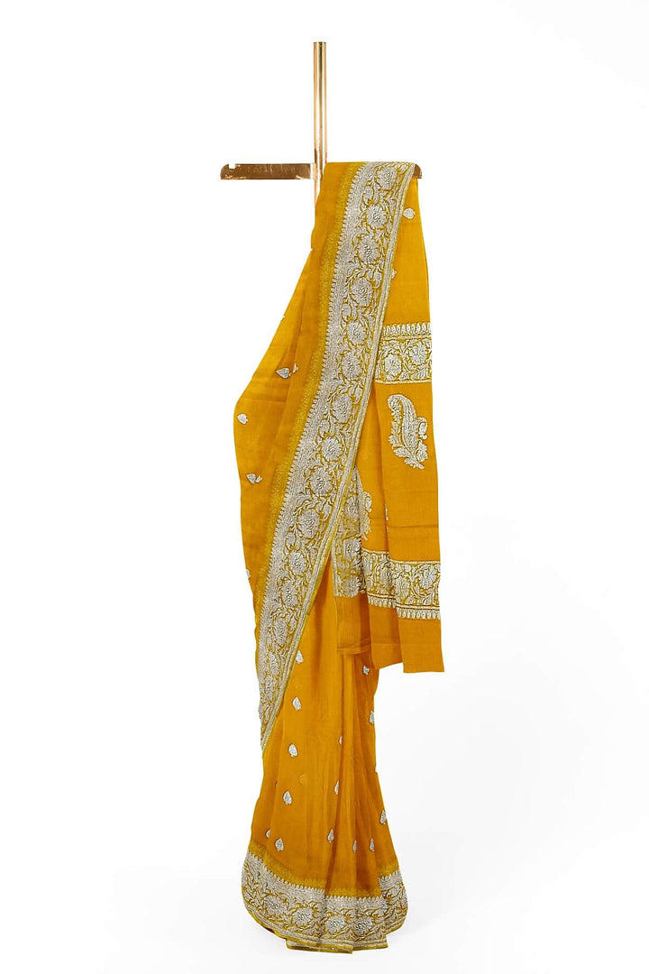 Banarasi silk chiffon  saree in yellow  with silver  buttis &  border