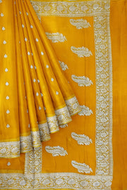 Banarasi silk chiffon  saree in yellow  with silver  buttis &  border